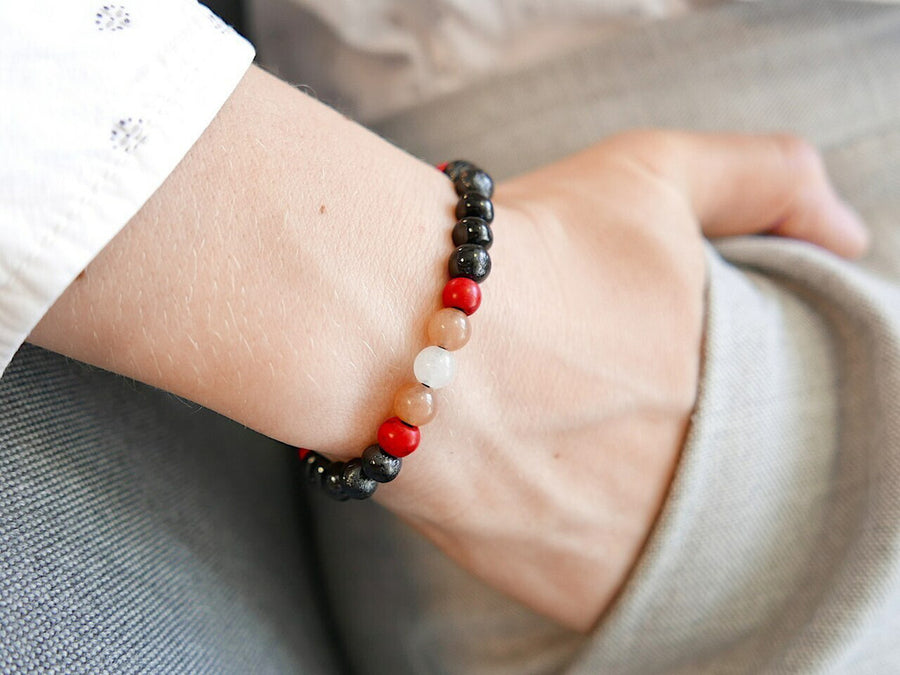 STRETCH POLISHED DARK CHERRY BALTIC AMBER ADULT BRACELET WITH SUNSTONE & MOONSTONE