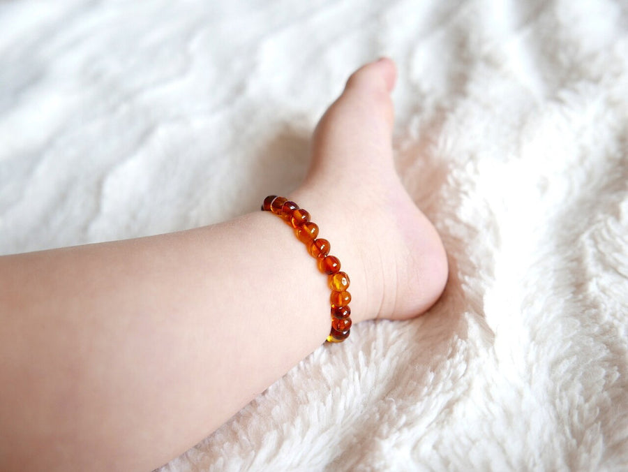 STRETCH POLISHED COGNAC BALTIC AMBER TEETHING ANKLET